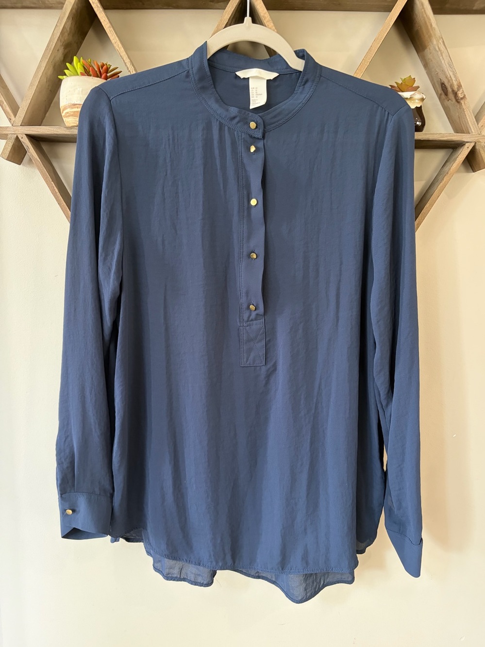H&M blue blouse. Lightweight. Gold buttons. Size 12.